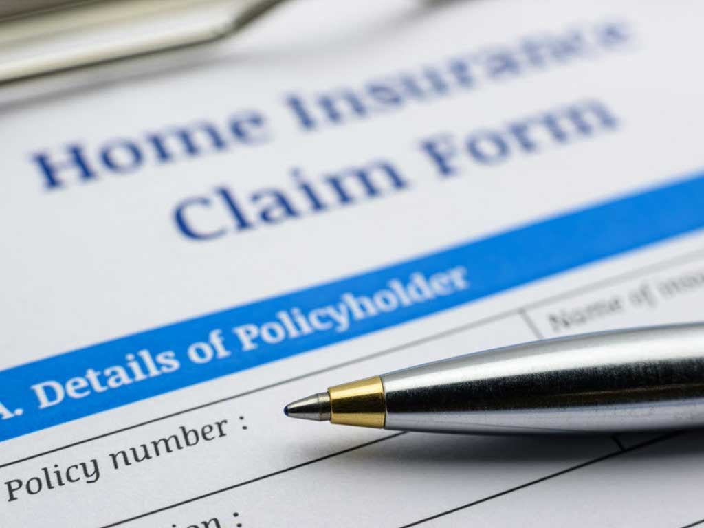 Pen resting on insurance claim form