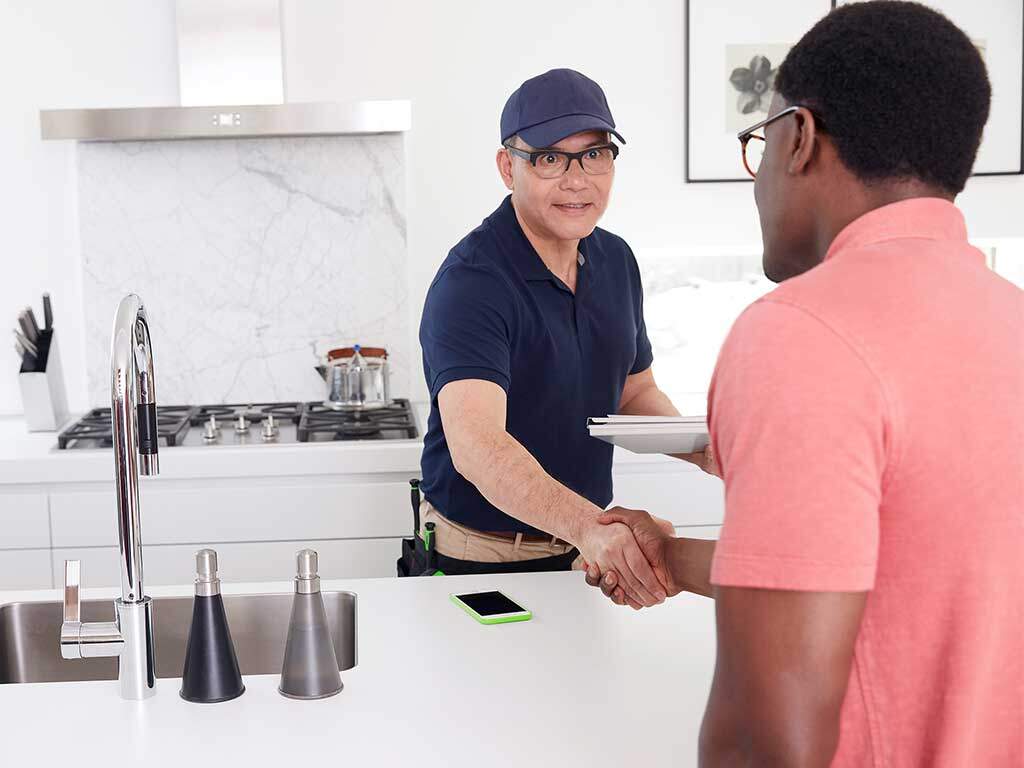 service-provider-shaking-hands-with-homeowner